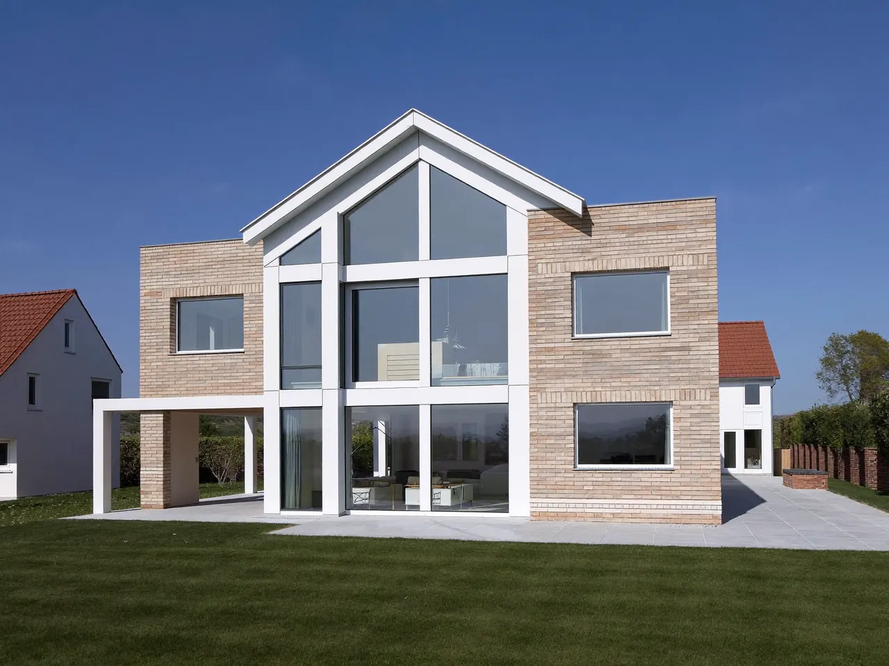 Modern UK home with white uPVC casement windows across the front elevation